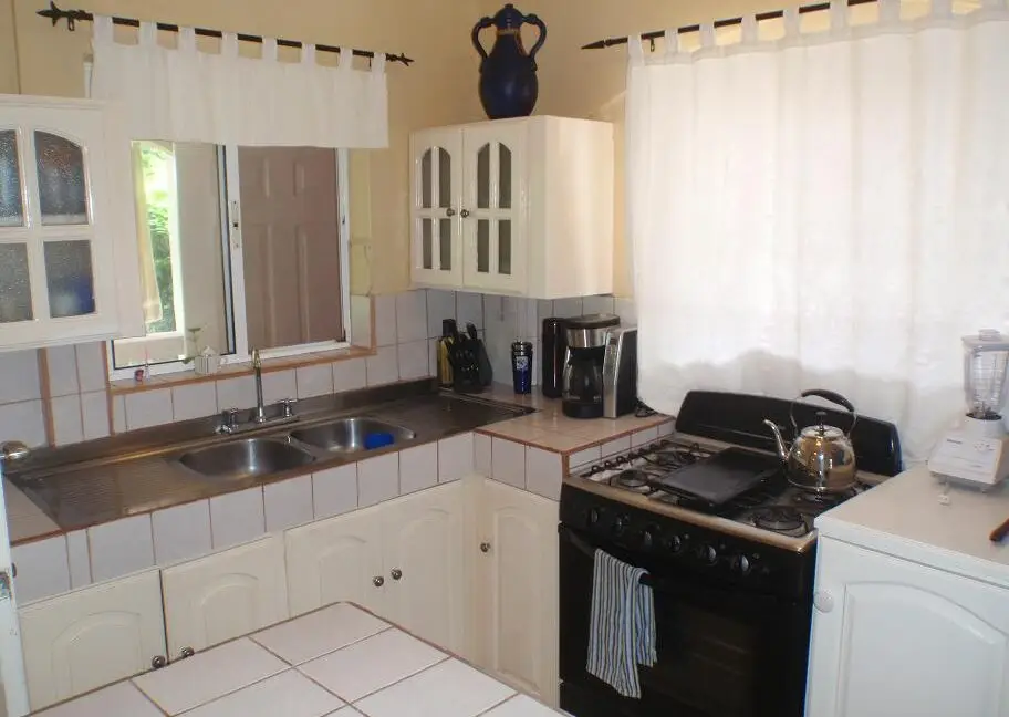 Open floor plan kitchen and dining space in Big Corn Villa for Sale