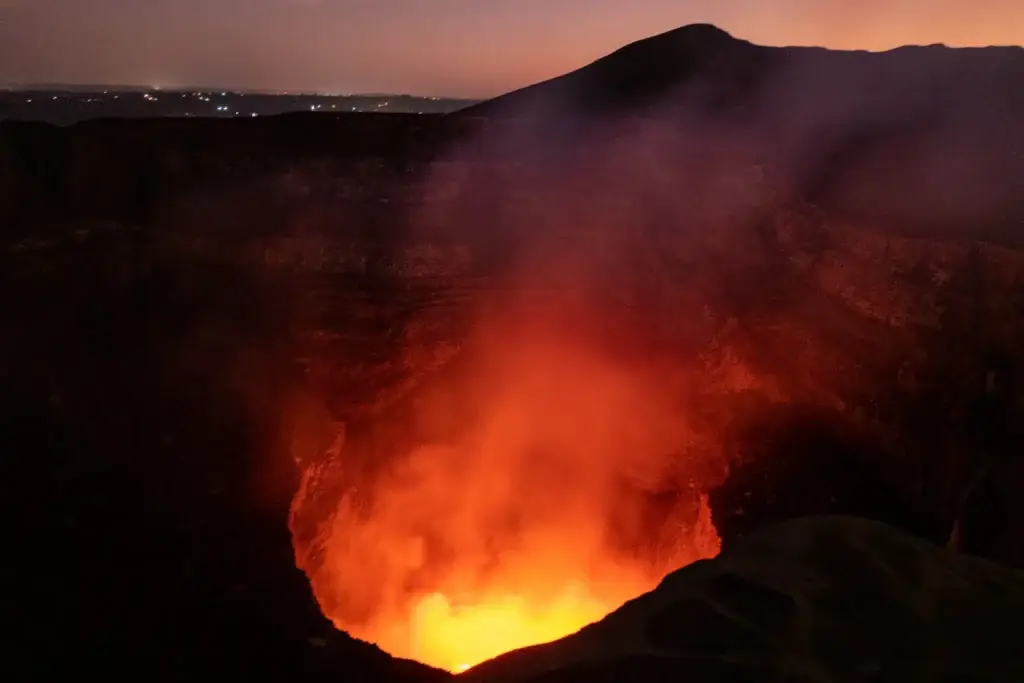 Intense red glow inside Santiago Crater Volcano after sunset