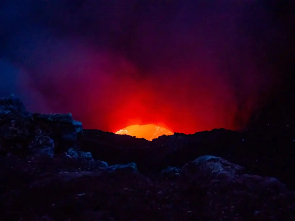 Santiago Crater Volcano lava glow visible through the crater opening at night