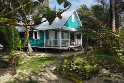 Little Corn Beach House for sale with 108 ft beach frontage, coconut palms, and ocean views on 1.4 acres in Nicaragua