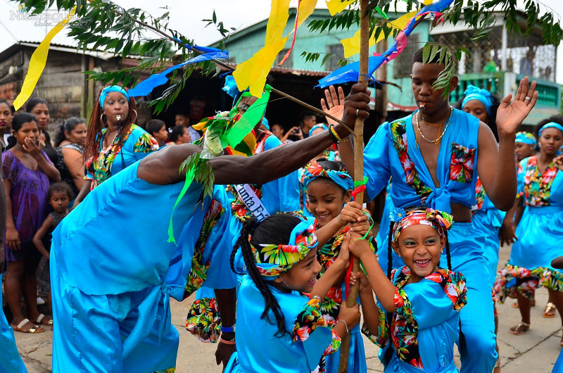 Vibrant Palo de Mayo celebration near Corn Island Lighthouse Little Corn Island Nicaragua