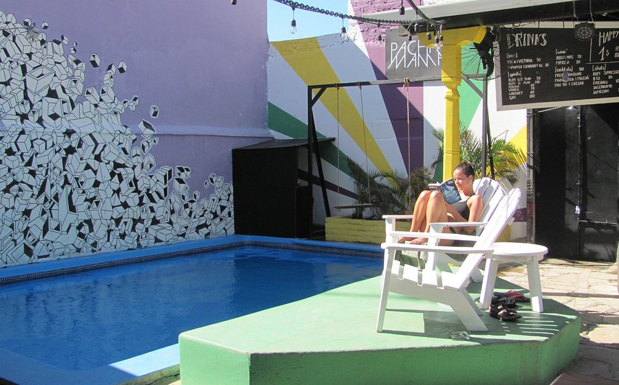 Pachamama Hostel Nicaragua girl sitting by the pool.